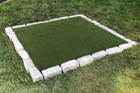 Tucson Tee box made of synthetic grass surrounded by stone border